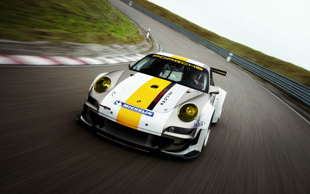 High-Speed Pursuit: Porsche 911 Dominates the Race Track in QHD Wallpaper