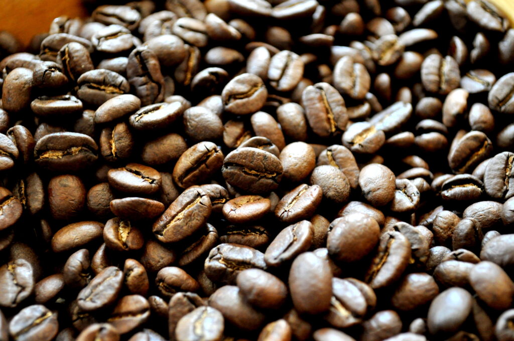 Rich Brown Coffee Beans Close-Up: Textured Caffeine Wallpaper