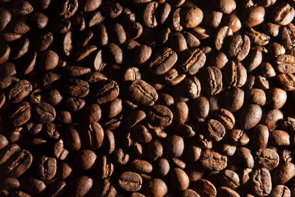Rich Brown Roasted Coffee Beans Wallpaper: Textured Caffeine Essence