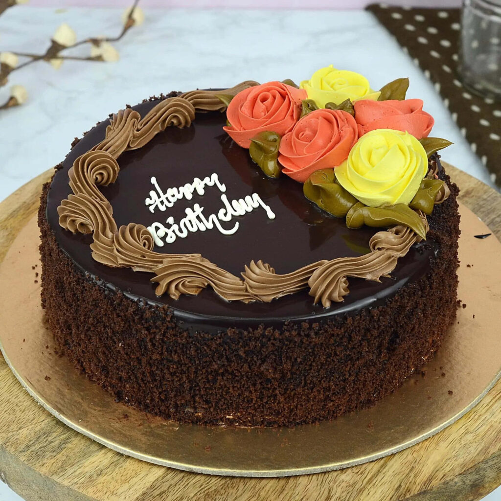 Elegant Chocolate Cake with Frosting Roses - Perfect for Celebrations Wallpaper