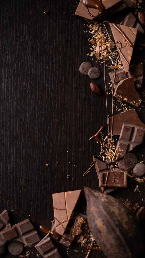 Rich Textured Chocolate & Cocoa Beans Wallpaper on Dark Wood