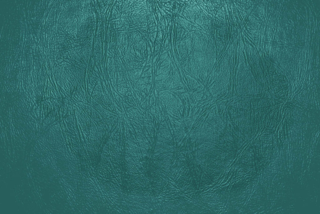 Elegant Green Leather Wallpaper: Intricate Patterns & Textured Background