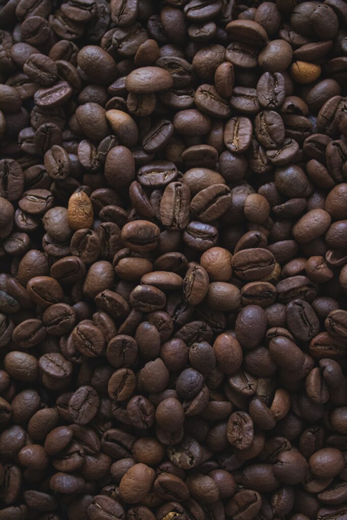 Textured Macro Shot of Brown Coffee Beans - Earthy Wallpaper Background