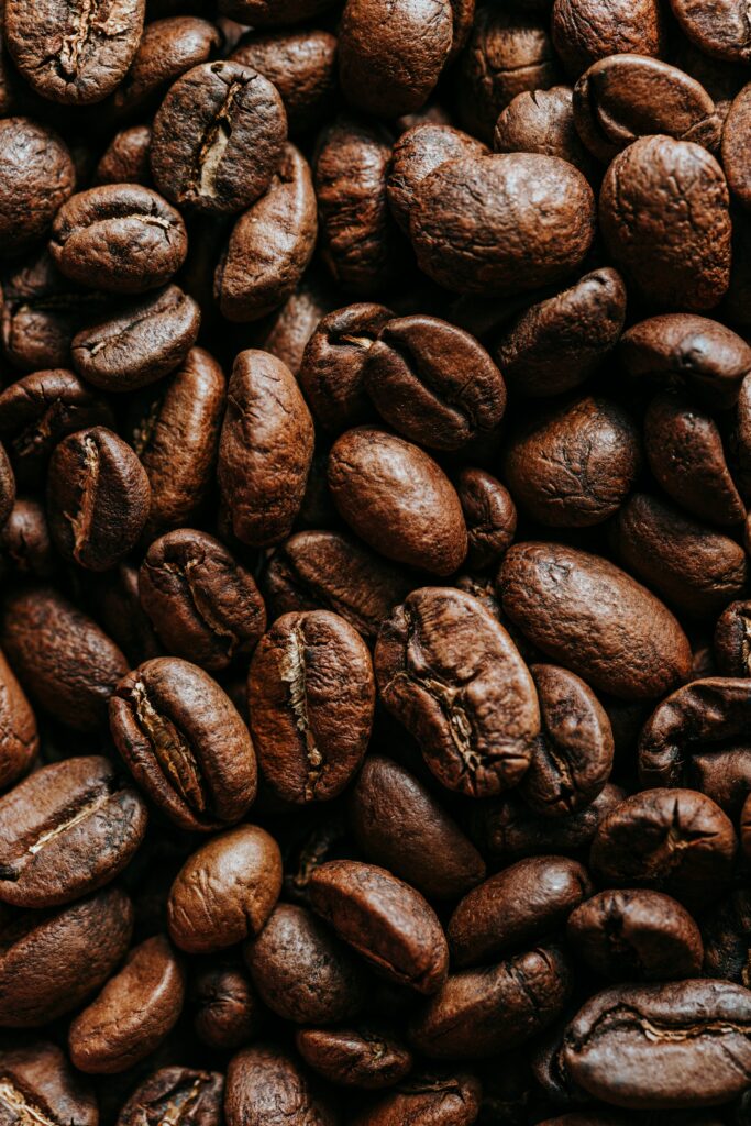 Rich Roasted Coffee Beans Wallpaper: Deep Brown Texture Background