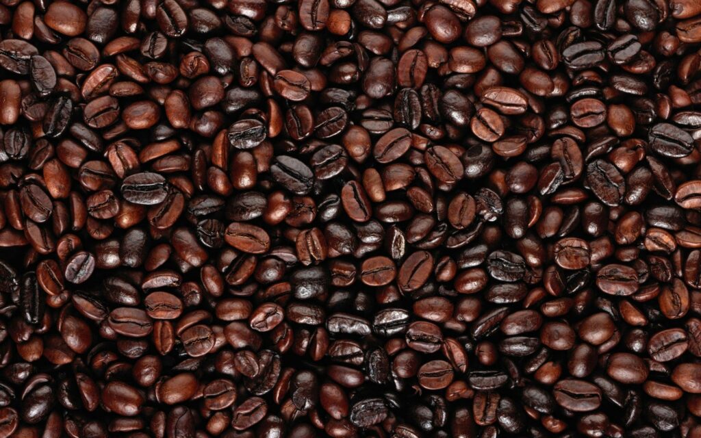 Rich Coffee Bean Wallpaper: Textured Deep Brown Background Design