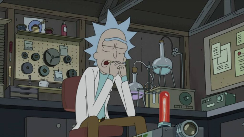 Rick Sanchez sad and weary in cluttered garage lab with scientific tools Rick and Morty wallpaper