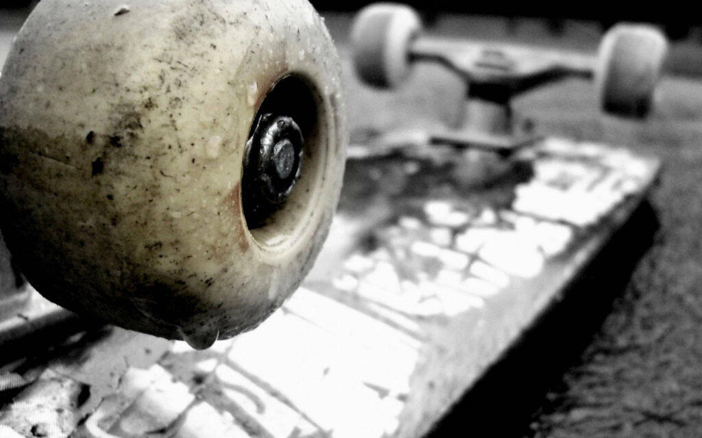 Riding the Urban Waves: Skateboard in High Quality QHD Wallpaper Background