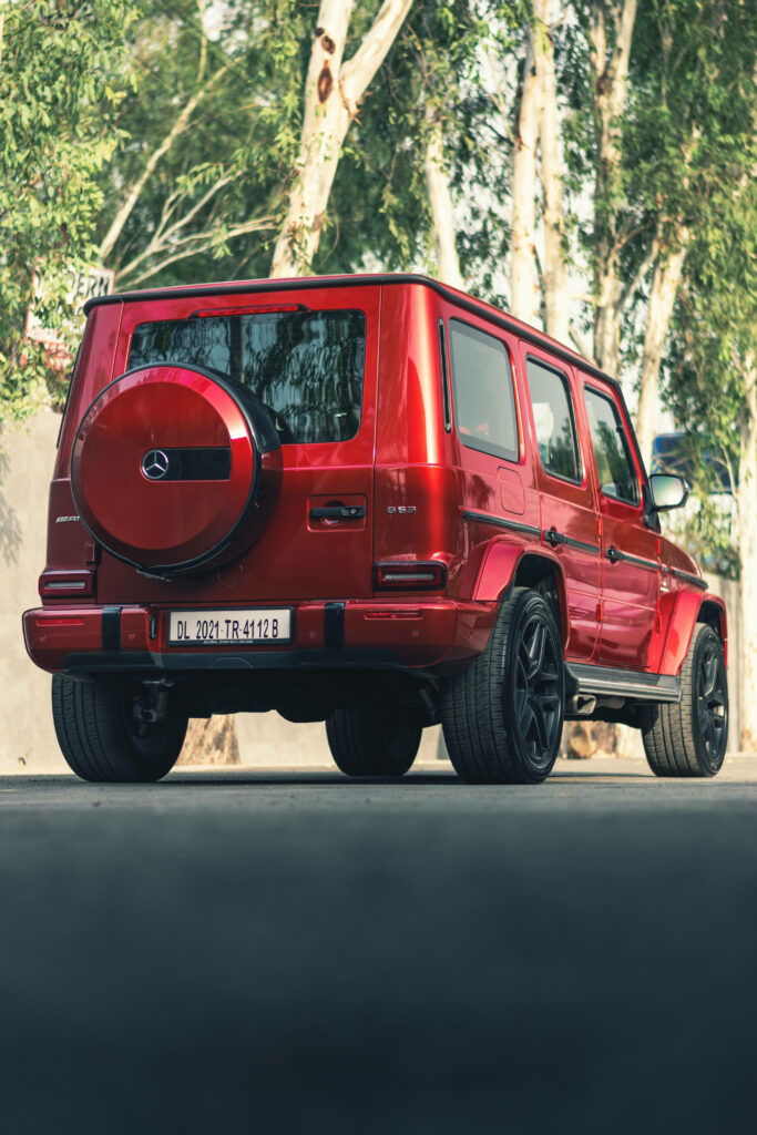 Sleek and Stylish: Mercedes AMG iPhone Background Featuring a Red Model Vehicle Wallpaper