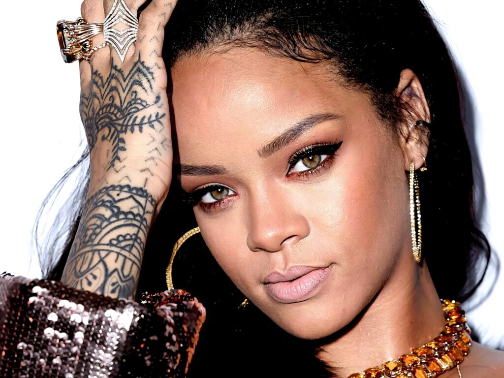 Stunning Rihanna Wallpaper: Unique Hand Tattoo & Glamorous Style
