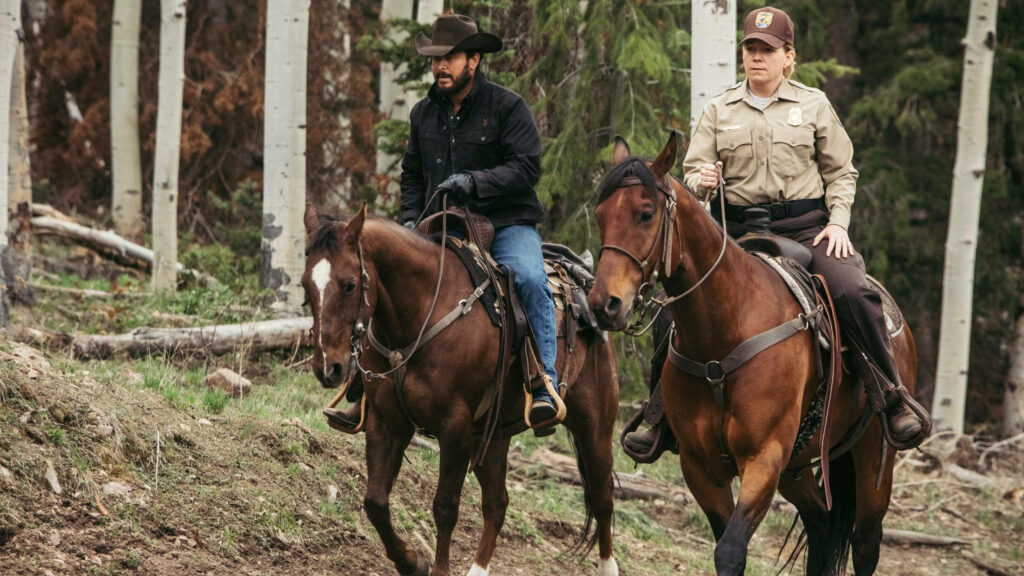 Rip Wheeler & Ranger Ride Through Serene Forest | Yellowstone Wallpaper