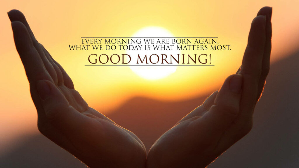 Cupped hands silhouette at golden sunrise with inspiring good morning quote wallpaper background