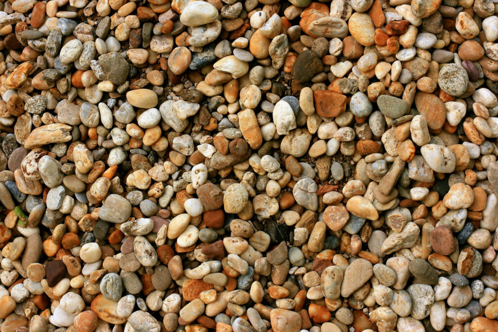 River Reflections: Nature's Radiant Rocks Wallpaper