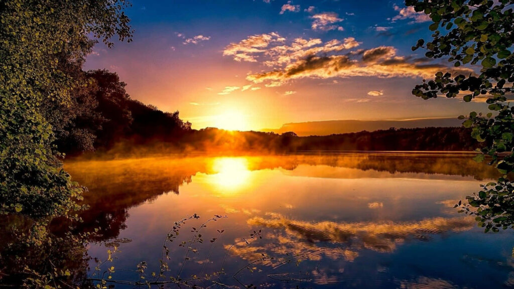 Riverside Radiance: Captivating Sun Rise Wallpaper with a Mesmerizing Blue Skyline