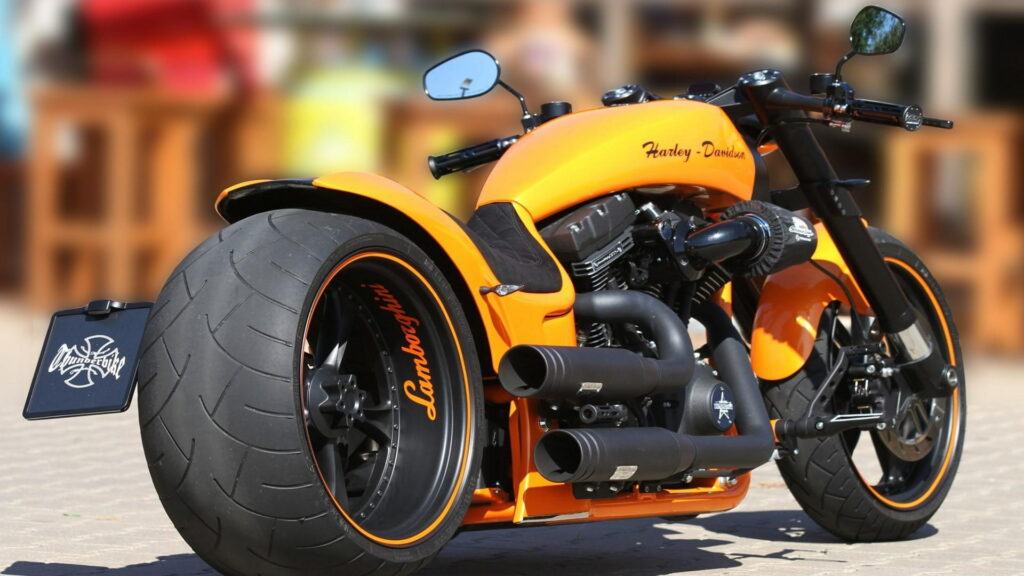 Riding the Thunder: HD Motorcycle Roaring through the Scenic Backdrop Wallpaper