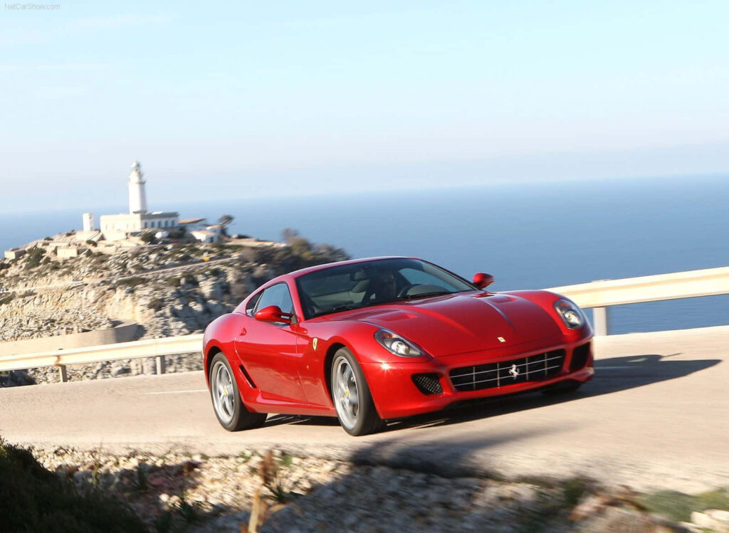 Red Ferrari 599 GTB Fiorano: Unleashing Italian Engineering on the Open Road - A Captivating Wallpaper for Car Enthusiasts