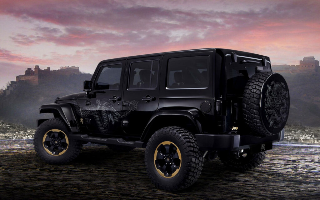The Beast Unleashed: A Sleek Black Jeep Wrangler Conquers the Night Wallpaper