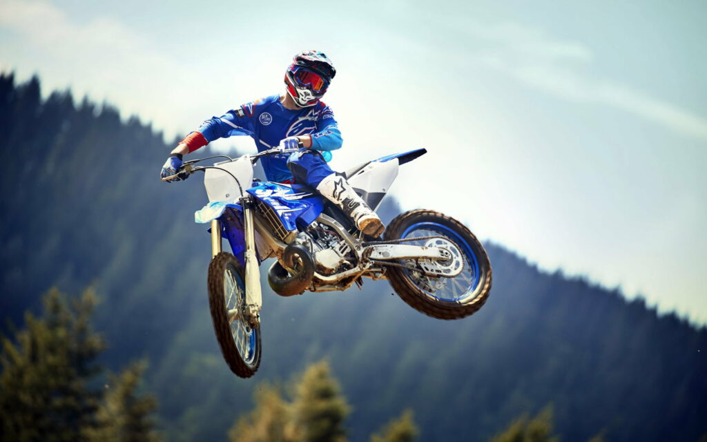 Thrilling Motocross Action: Yamaha YZ450F Soaring High in 2018 Wallpaper