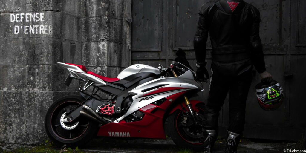 Daring Yamaha R6 Rider: A Captivating HD Wallpaper Image of Yamaha's Thrilling Motorcycle