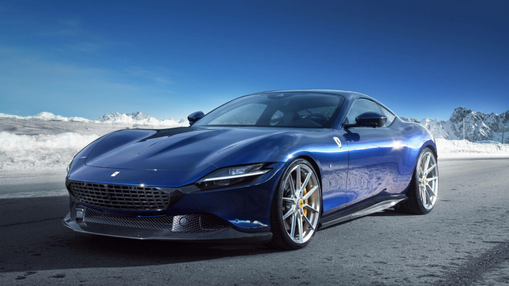 Blue Ferrari Roma Roars on Snowy Road: 2560x1440 Wallpaper