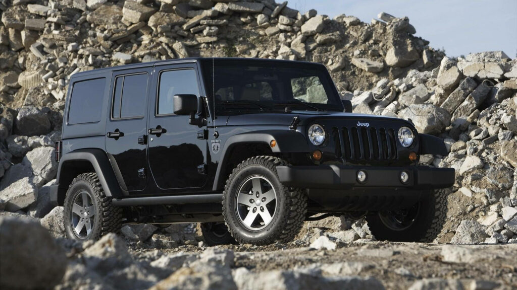 Off-Road Adventures: Capturing the Spirit of a Black Jeep Wrangler in a Rocky Quarry Wallpaper