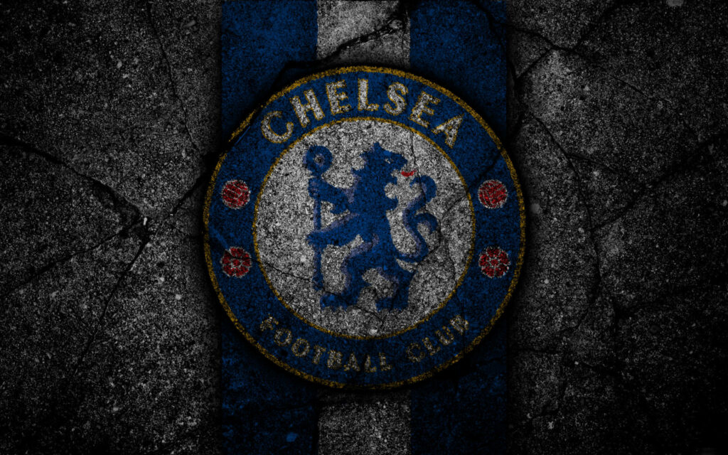 Chelsea Rocked: A Stunning Display of Team Logo on Cement Wallpaper