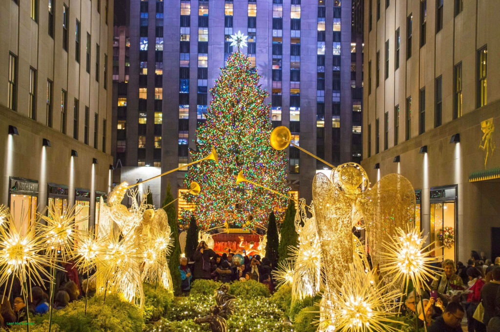 Festive Rockefeller Center: Iconic Christmas Tree & Illuminated Angels Wallpaper