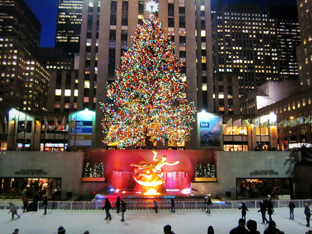 Rockefeller Center Ice Skating: Festive Winter Scene with Christmas Tree Wallpaper