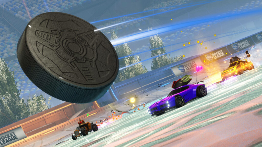 Rocketing into Victory: Intense Battle Cars Collide on a Giant Soccer Stage Wallpaper