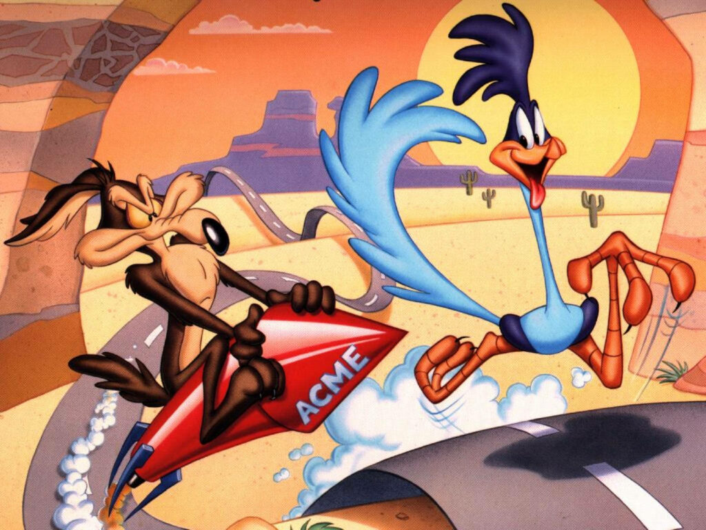 Rocket-Powered Pursuit: Wile E. Coyote Races on a Rouge Rocket, Hot on the Heels of Road Runner! Wallpaper