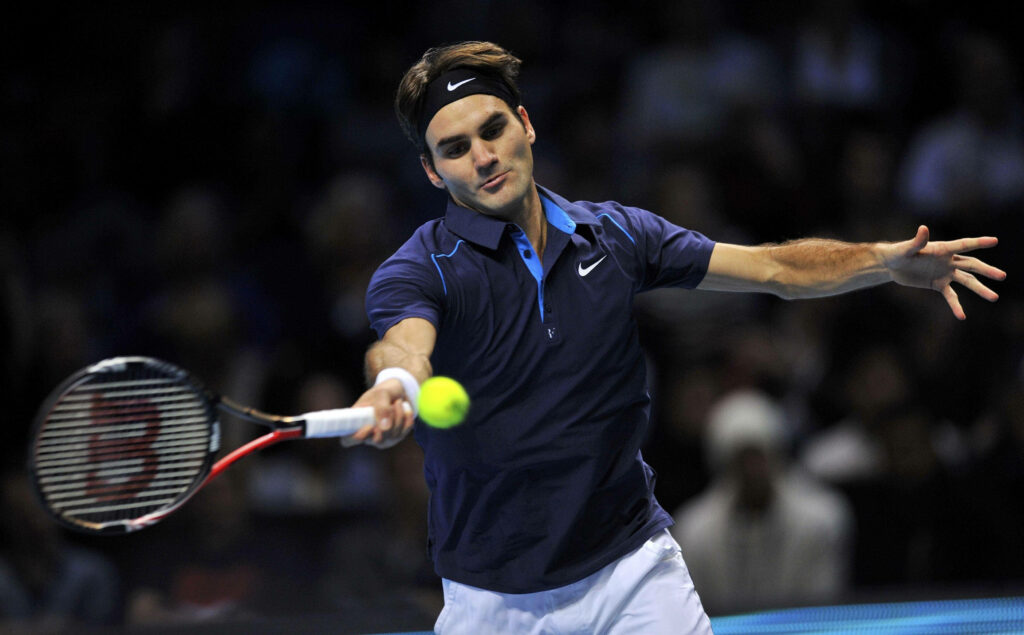 Roger Federer in Action: Dynamic Tennis Wallpaper Background