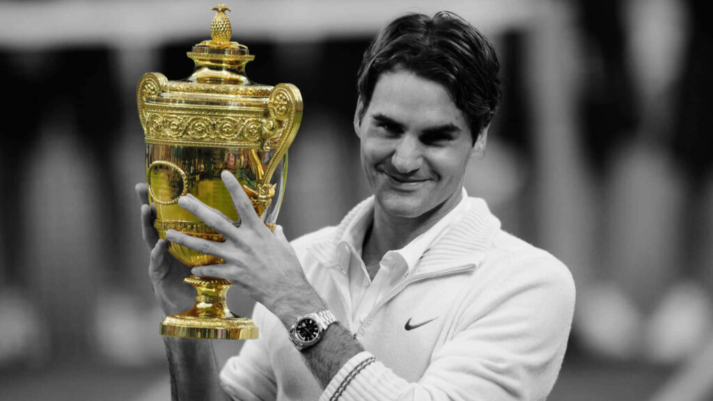 Roger Federer Holding Golden Trophy: Iconic Tennis Legend Wallpaper