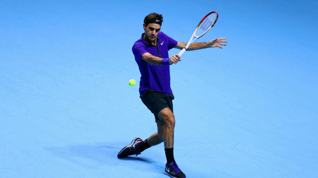 Roger Federer in Action: Tennis Precision Wallpaper Against Blue Court