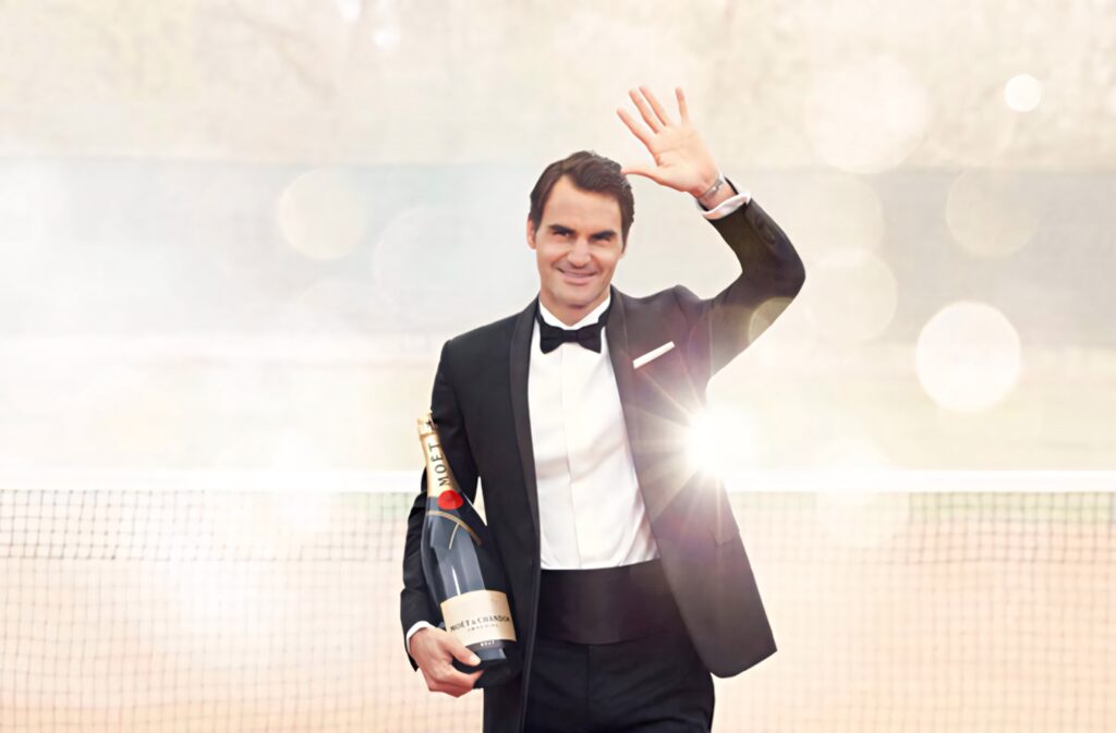 Elegant Roger Federer in Tuxedo with Moët: Glamorous Wallpaper