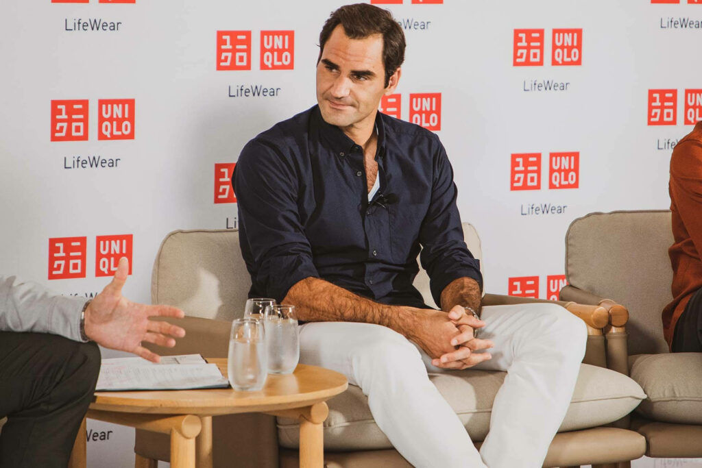 Roger Federer Uniqlo Event Wallpaper: Stylish Background Display