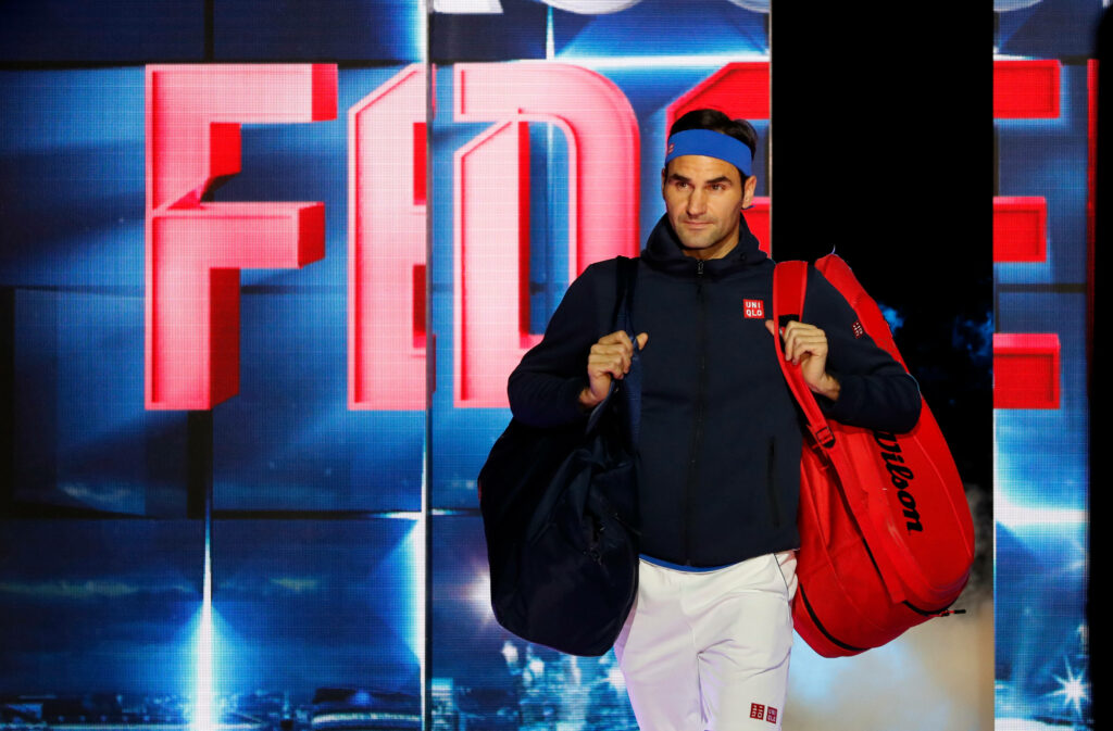 Confident Roger Federer Wallpaper: Tennis Bags & Bold Visuals