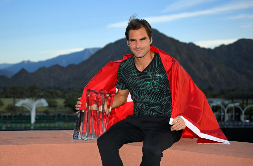 Roger Federer Wallpaper: Triumph Amidst Scenic Mountains