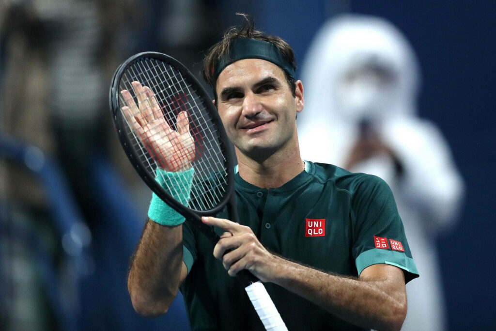 Roger Federer in Green Uniqlo Outfit: Charismatic Tennis Wallpaper