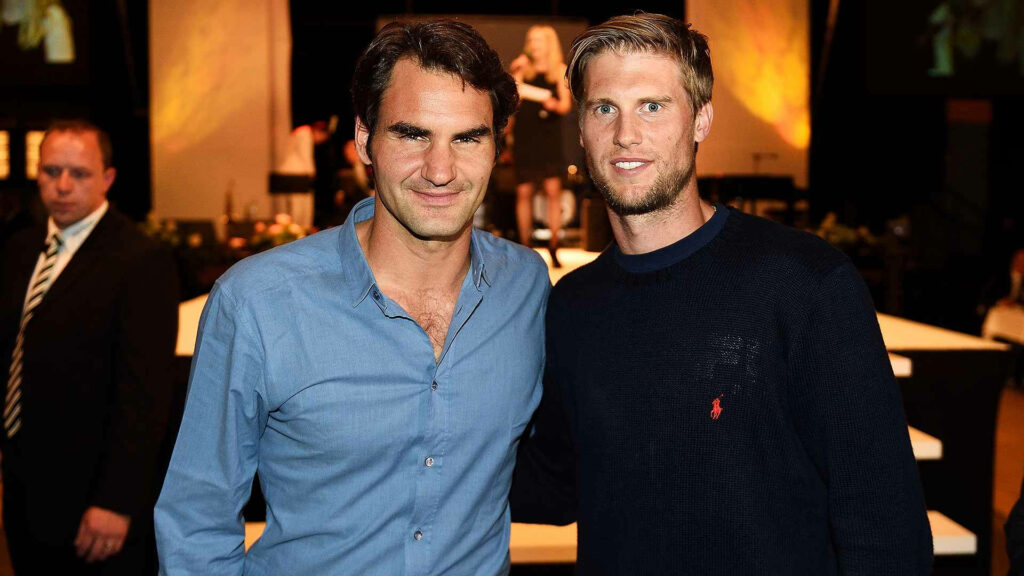 Roger Federer and Andreas Seppi smiling together in casual attire friendly relaxed atmosphere wallpaper