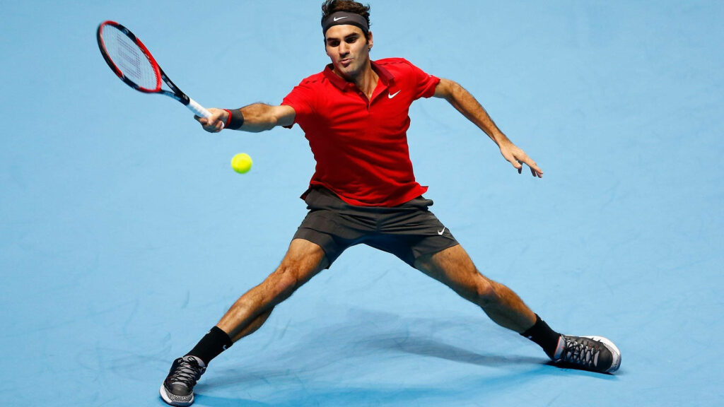 Roger Federer in Action: Stunning Red Outfit Tennis Wallpaper