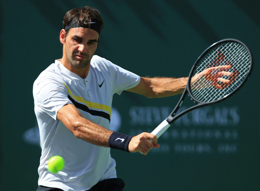Roger Federer in Nike: Dynamic Tennis Action Wallpaper Background