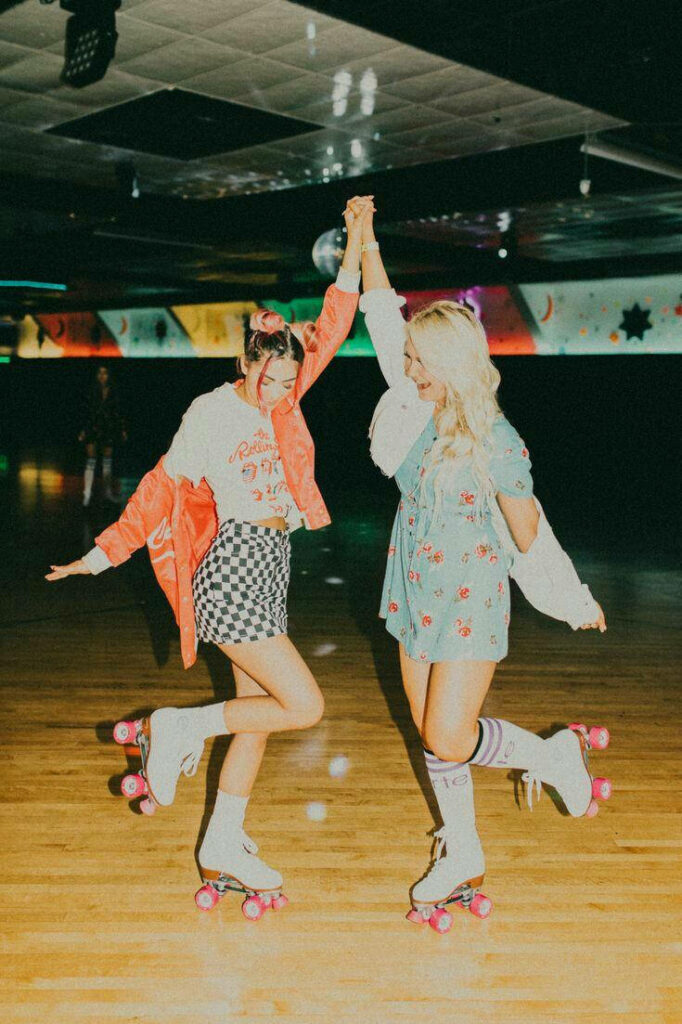 Blissful Friendship Journey through Time at an Abandoned Roller Rink Wallpaper