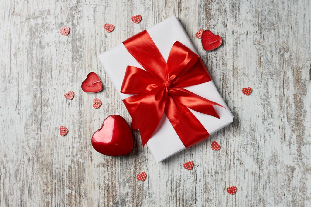 Romantic Gift Box Wallpaper: Red Ribbon & Heart Decorations