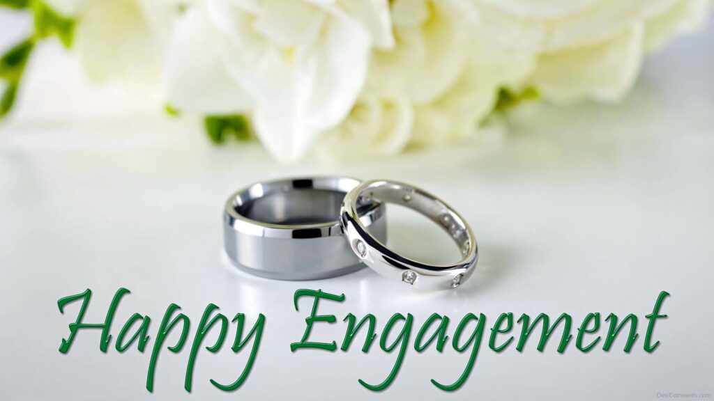 Happy Engagement wallpaper with two rings and white flowers romantic congratulatory design