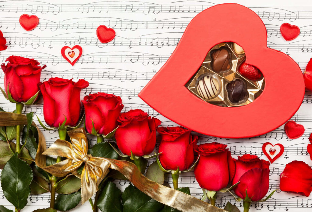 Charming Heart-Shaped Chocolate Box with Roses & Music Notes Wallpaper