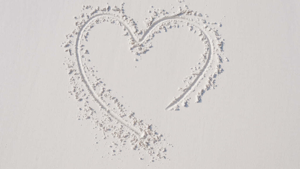 Heart Shape in Soft White Sand: A Simple Love Wallpaper