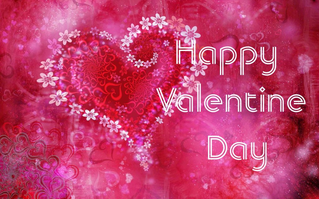 Romantic pink flower heart Valentines Day wallpaper with floral patterns and glowing background