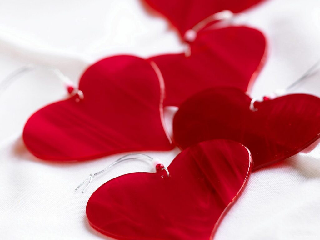 Charming Red Heart Wallpaper on White Background for Romantic Decor