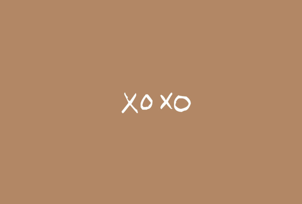 Celebrating Warmth: A Serene Cocoa-Hued Canvas with an XOXO Embrace Wallpaper