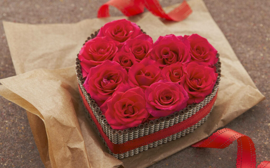 A Heartwarming Gesture: Capturing Love and Passion with a Gorgeous Bundle of Red Romantic Roses Wallpaper