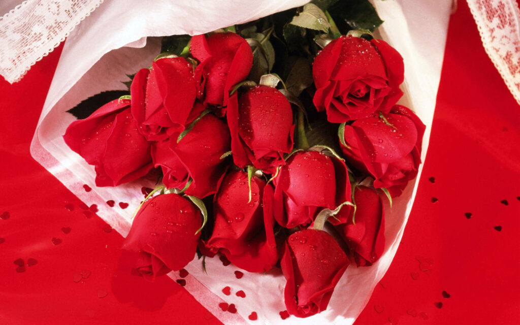 Love Blossoms: Exquisite Red Roses Embraced by Delicate White Paper, Adorned with Glittering Heart Sequins Wallpaper
